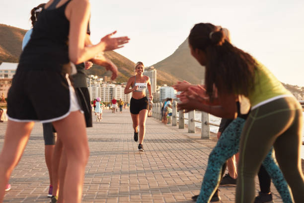 istock Young people encouraging race runners 504863218