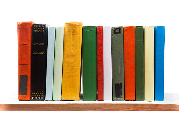 istock Stack of books at wooden shelf isolated on white background 504865200