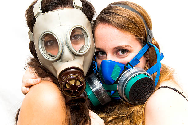 istock Two beautiful women with gas mask 504865942