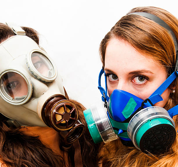 istock Two beautiful women with gas mask 504866028