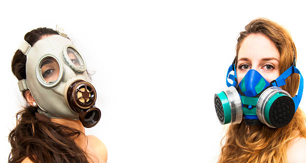 istock Two beautiful women with gas mask 504866082