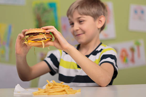istock Child with appetite for hamburger 504867254