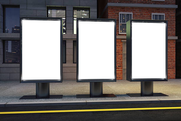 istock Blank white three billboards on empty street at night 504867868