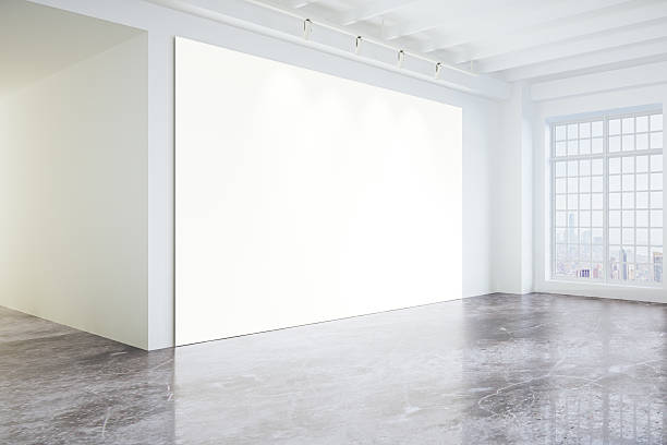 istock Blank poster in light modern loft gallery with big windows 504868348