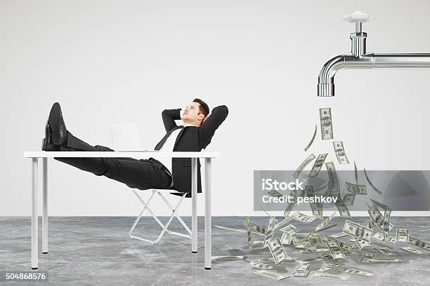 Businessman Resting On A Chair And Faucet From Stock Photo - Download Image Now - Currency, Serene People, Finance