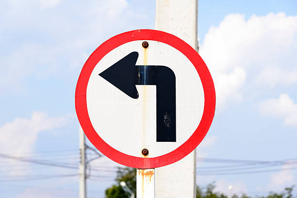 istock turn left traffic sign with the rusty 504874926