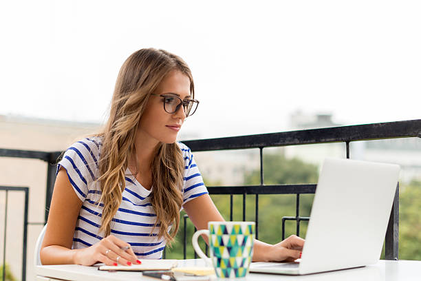 istock Young woman working on laptop 504877996