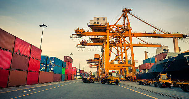 istock Cargo ship in the harbor at sunset . 504878700