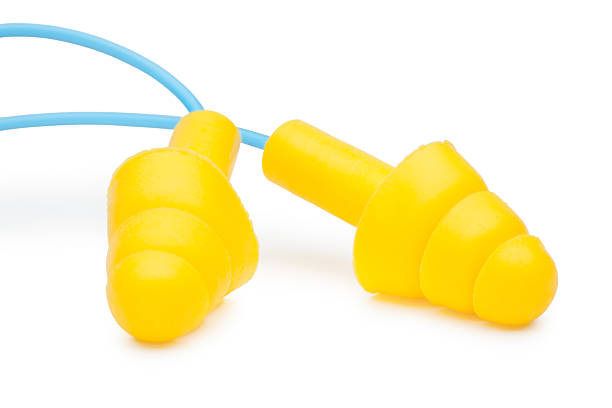 Yellow earplugs stock photo