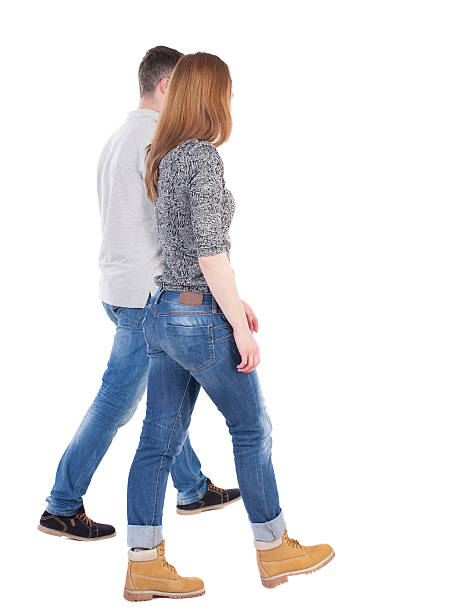 istock Back view going couple. walking friendly girl and guy 504879134