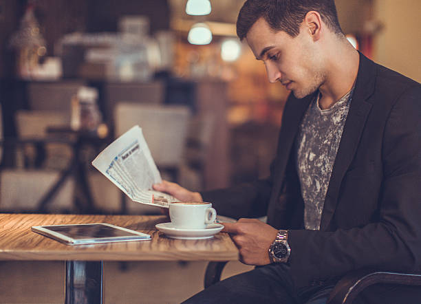 istock young businessman reading a newspaper 504879994