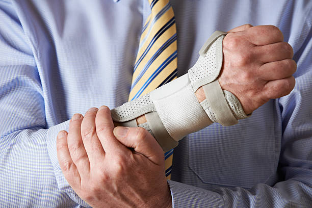 Close Up Of Businessman Suffering With Repetitive Strain Injury stock photo