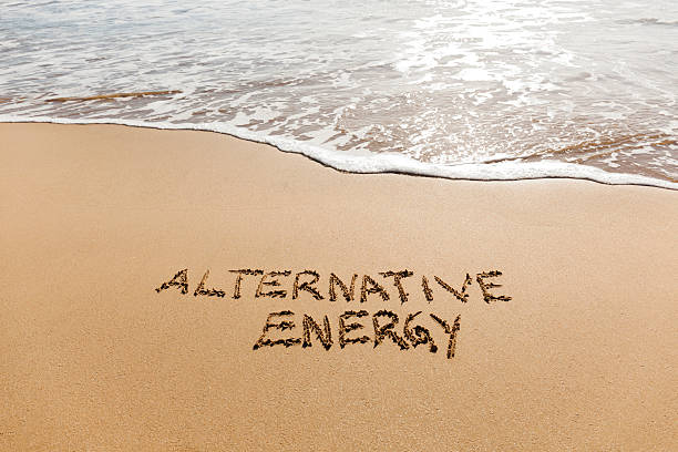 istock Alternative Energy written in the sand on a beach. 504887030