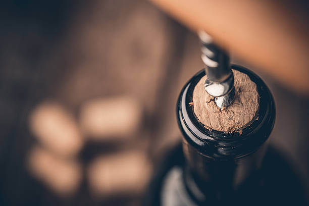 istock Corkscrew and bottle of wine on the board 504888360