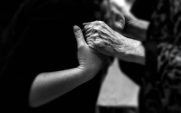 istock Young and old woman dancing and holding eachothers hands 504889180