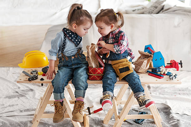 Two little Carpenters Two little girls having lunch break construction lunch break stock pictures, royalty-free photos & images