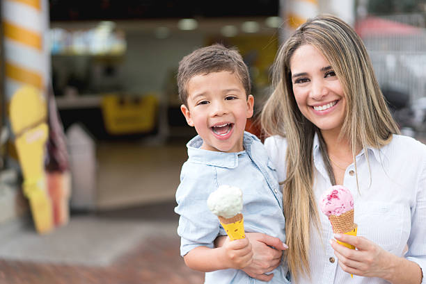 istock Happy mother and son eating ice cream 504889622