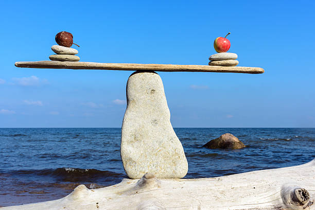 istock Apples on narrow plank 504890050