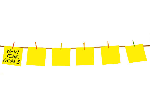 istock New Year Goals on Yellow sticky notes hanging on clothesline 504890978