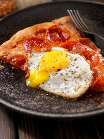 Hangover Breakfast,Leftover Pizza and a Fried Egg - Photographed on a Hasselblad H3D11-39 megapixel Camera System