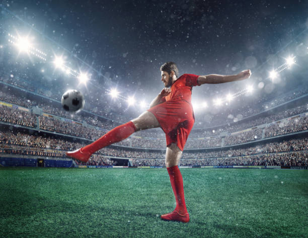 istock Football player kicking a ball 504896560