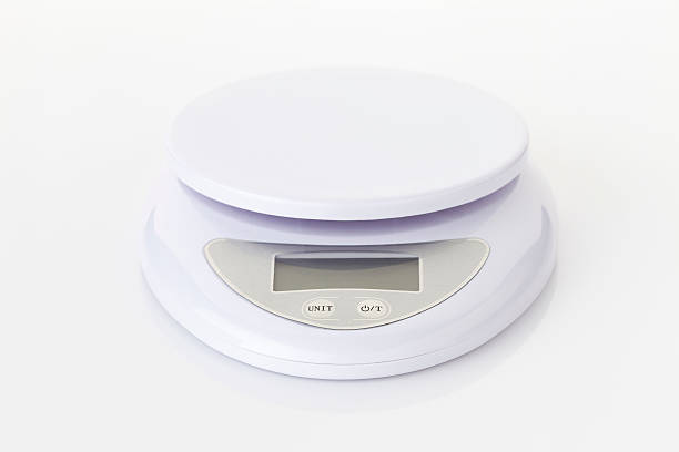 istock Digital food scale electronic weight balance on white backgrooun 504897852