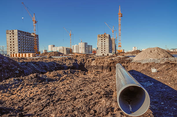 istock Industrial cranes and residential development 504898292