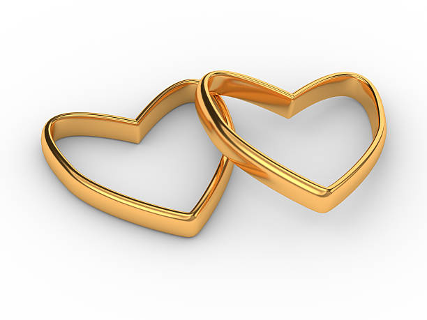 istock Two gold hearts rings isolated on white 504900448