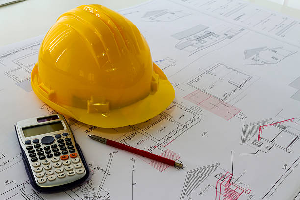 istock An office desk with the project papers and protective helmet 504900706