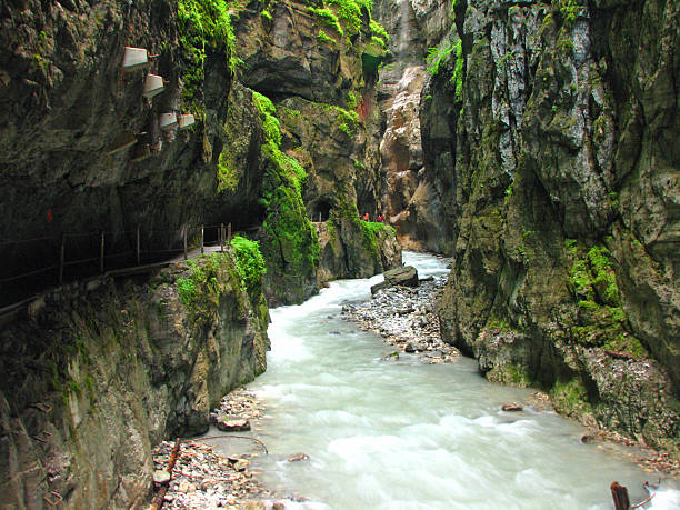Through the Canyon Partnach Gorge in Bavaria, Germany partnach gorge stock pictures, royalty-free photos & images