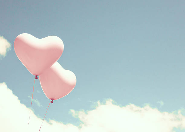 istock Pink heart shaped balloons 504901810
