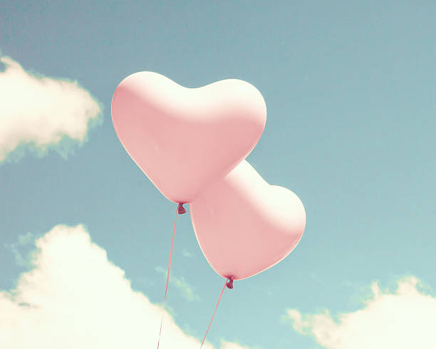 istock Pink heart shaped balloons 504901874
