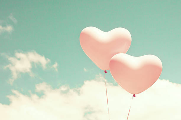 istock Pink heart shaped balloons 504901924