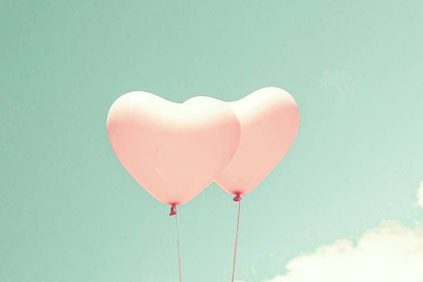 istock Pink heart shaped balloons 504902036