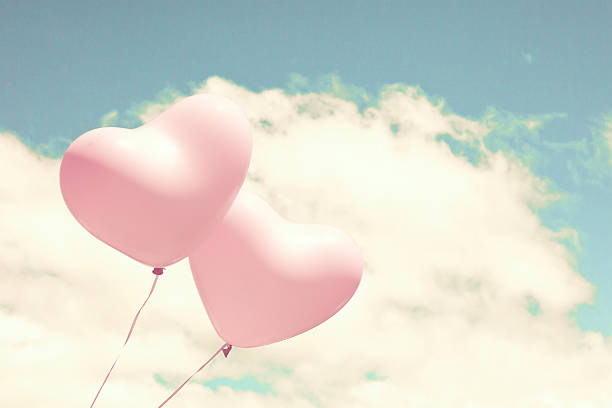 istock Pink heart shaped balloons 504902094