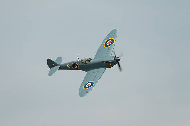 Spitfire in flight Abingdon, UK - May 4th, 2014: A vintage World War Two, British Supermarine Spitfire  in flight at Abingdon Air Show. spitfire stock pictures, royalty-free photos & images