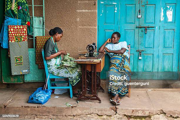 Two African Woman Sitting Next To Sewing Machine Stock Photo - Download Image Now - Business, Tanzania, Tanzanian Culture