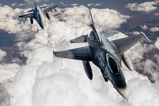 Jerusalem, Israel - May 5th, 2022: Three israeli air force Lockheed Martin F-35 aircrafts, flying in a hazy, cloudy sky.
