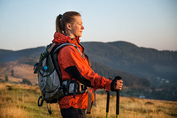 Young woman hiking in the mountains stock photo