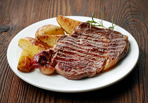 istock grilled beef steak and potatoes 504904336