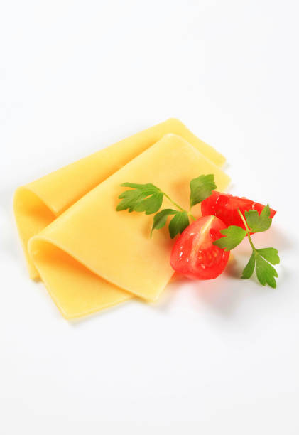istock Sliced cheese and tomato wedges 504904342