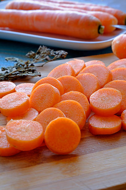 istock Fresh carrot slices portrait side tight 504904742