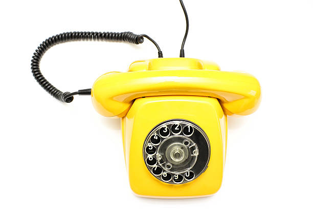 istock Yellow retro telephone isolated on white background. 504906000
