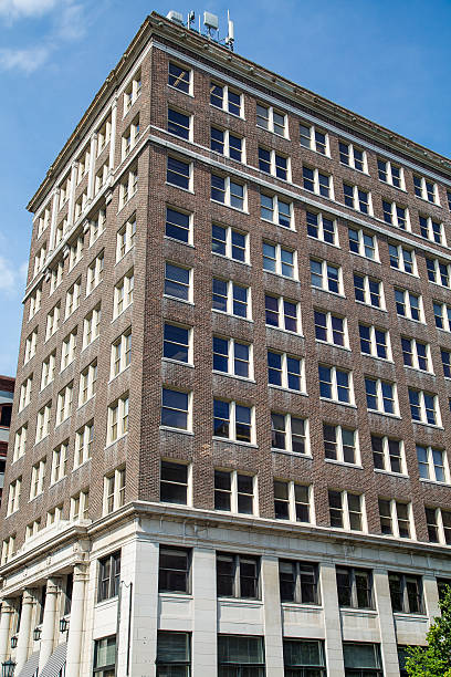 istock Old Square Brick Building Under Blue Skies 504908567