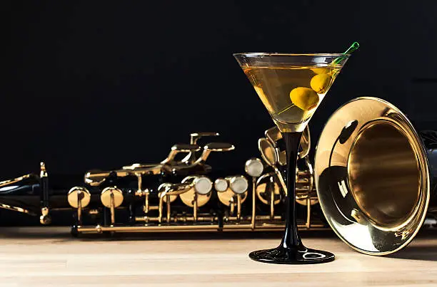 Photo of saxophone and martini with green olives