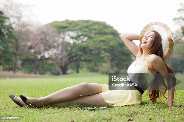 Relaxing On The Lawn Stock Photo - Download Image Now - Adult, Communication, Cute