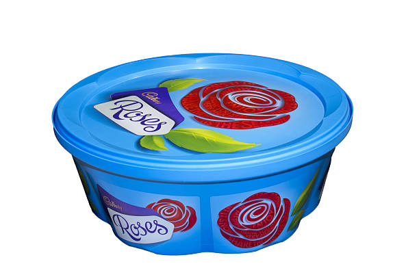 Cadbury Roses Darmstadt, Germany - January 14, 2016: A 729g plastic tub of individually wrapped chocolates with a variety of fillings. Often these are purchased in the UK and Ireland as Christmas or birthday gifts. cadbury plc photos stock pictures, royalty-free photos & images