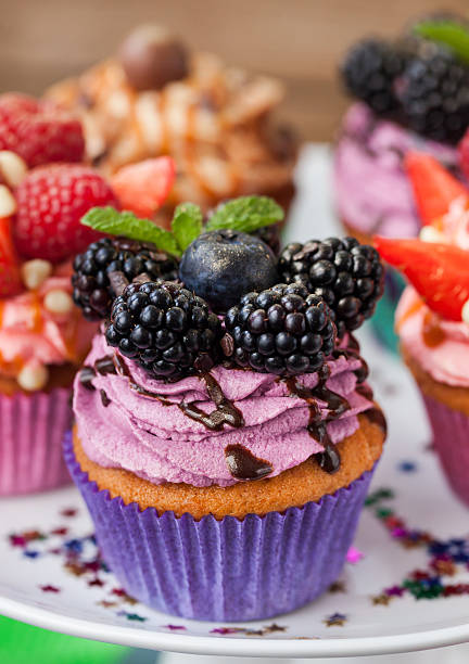 istock Delicious cupcake decorated with blueberry and blackberries 504910186