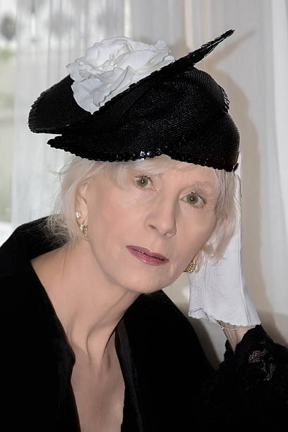 istock Senior Female Adult With Old Fashioned Hat 504911596