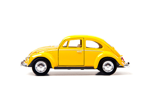 Izmir, Turkey - January 5, 2013: Vintage toy Volkswagen car close up image on isolated white background.